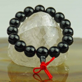 Onyx bracelet with a red ball coral
